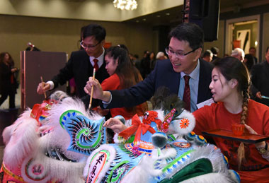 Hong Kong Commissioner for Economic and Trade Affairs, USA, Mr Eddie Mak (right) and Director of the Hong Kong Economic and Trade Office, San Francisco, Mr Ivanhoe Chang (left) conduct the eye-dotting ceremony at the Spring Reception in Los Angeles on February 6.